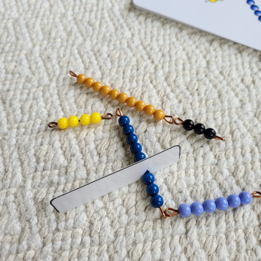 place a golden bead bar to the left of the indicator