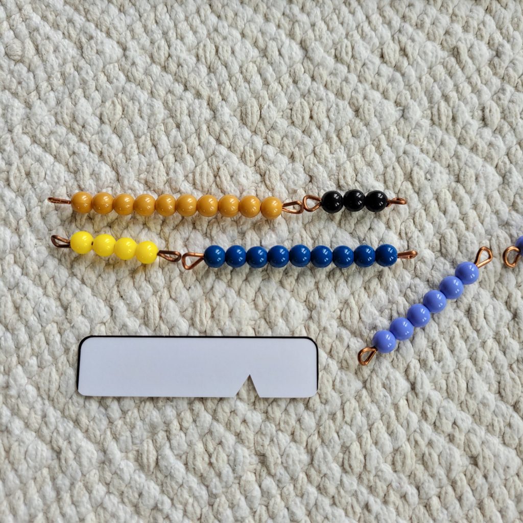 place a golden bead bar to the left of the indicator